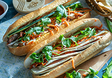 Vietnamese Food To Try - Traditional Banh Mi, crispy baguette with meats, vegetables and fresh herbs