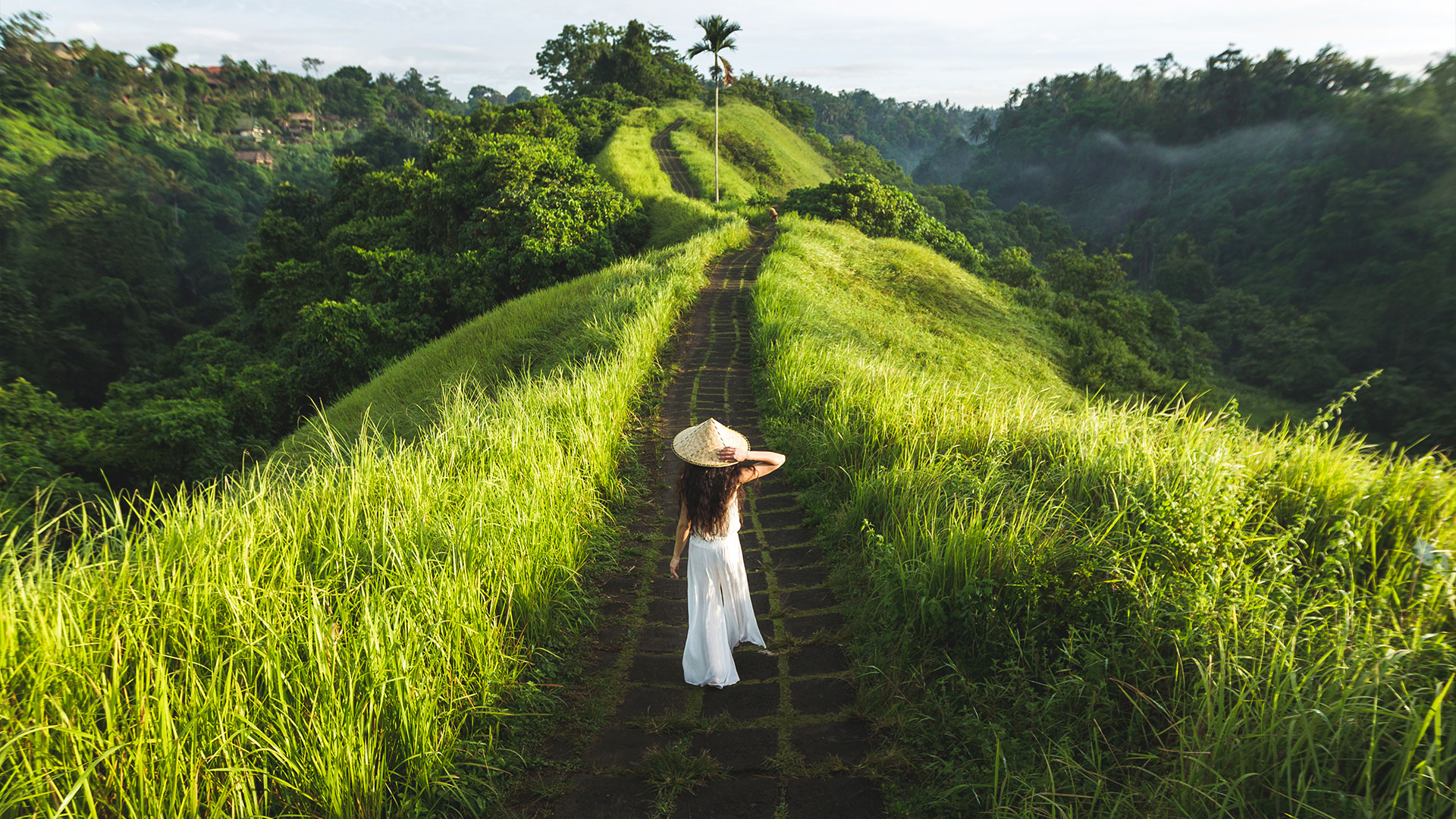 Woman taking a morning stroll along Campuhan Ridge Walk, Bali, Indonesia